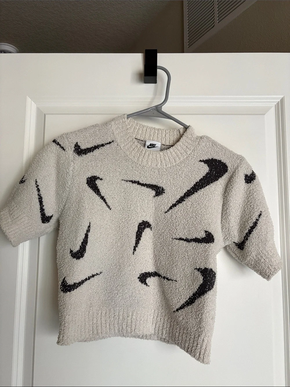 Nike Cream Short-Sleeve Fuzzy Sweater with Black Swoosh Motif